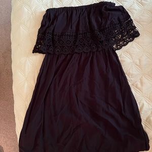 Black strapless sundress with detail.